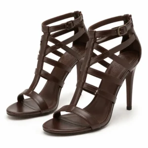 Private label caged multi strap high heel sandal in a chocolate brown studio presentation, shown from a front three-quarter angle for brands, wholesalers, retailers, importers and B2B footwear sourcing.
