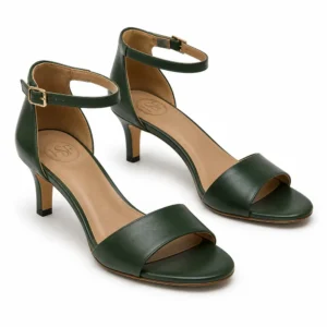 Private label closed back ankle strap sandal mid heel in a forest green studio presentation, shown from a front three-quarter view for brands, wholesalers, retailers, importers and B2B footwear sourcing.