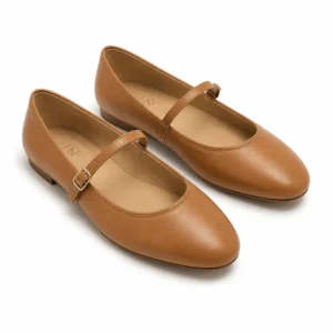 Private label Mary Jane ballet flat slim strap in a warm tan presentation, shown from a front three-quarter view for brands, wholesalers, retailers, importers and B2B footwear sourcing.