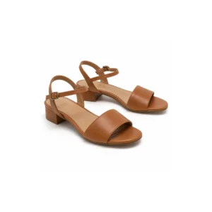 Private label wide fit low block heel ankle strap sandal in warm tan studio presentation, main view for footwear brands, wholesalers and B2B sourcing teams.