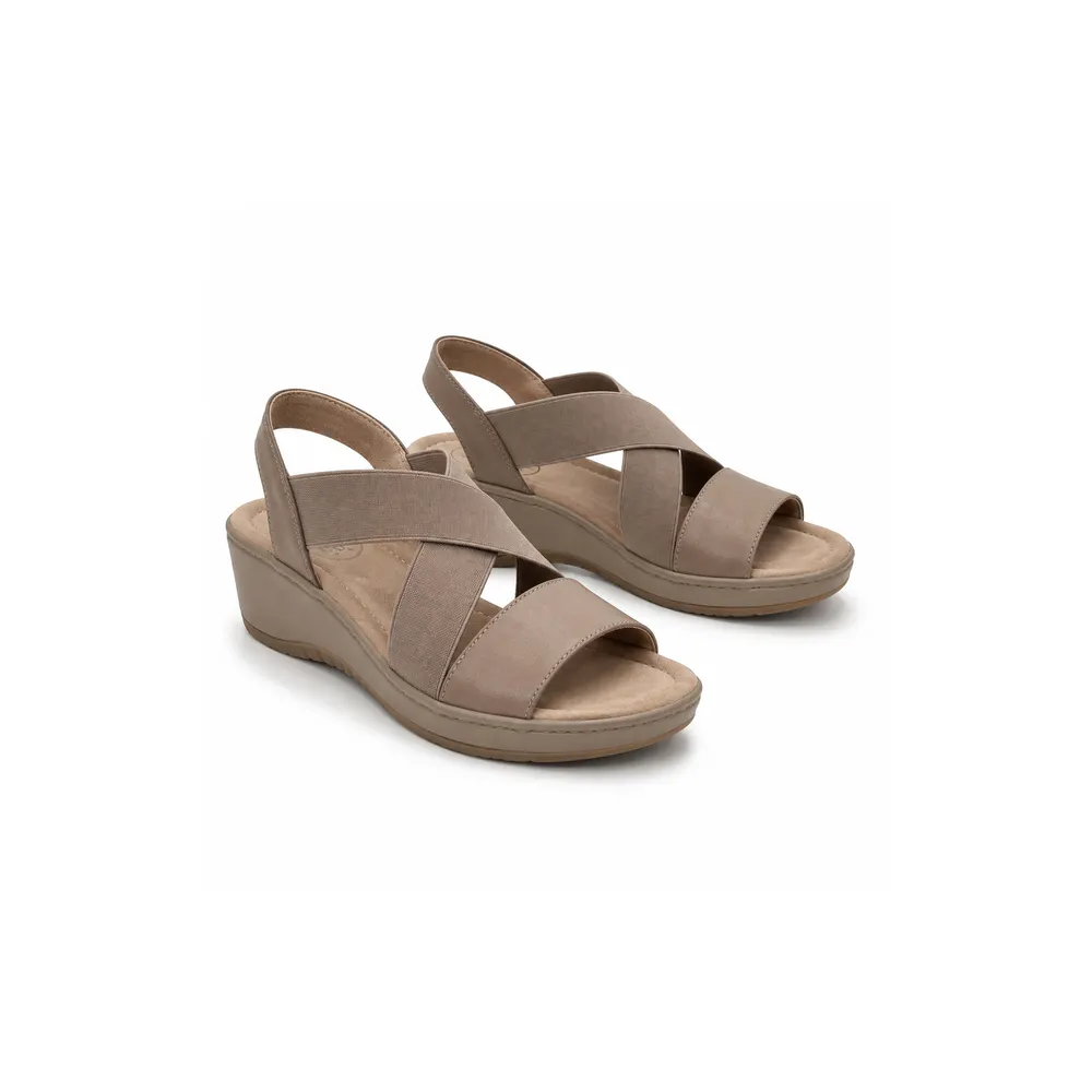 Private label elastic strap comfort wedge sandal in soft taupe studio presentation, main product view for footwear brands, wholesalers, importers and B2B sourcing teams.